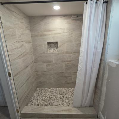 Stone-look shower remodel by Firenova
